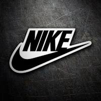 a black and white nike logo on a metal surface